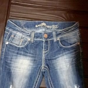 Almost Famous dark washed out holy jeans size 7 long skinny jeans